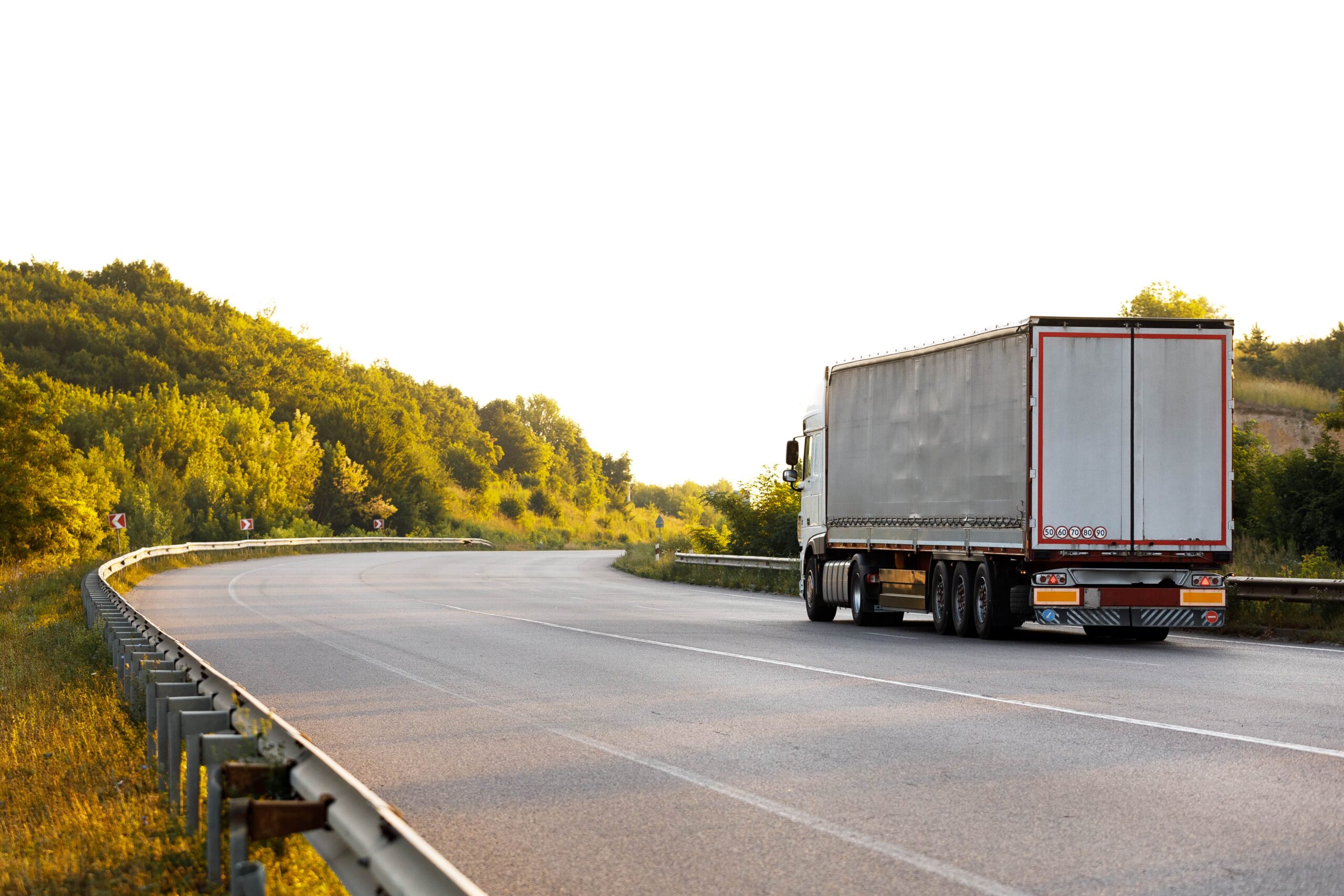 arriving-truck-road-rural-landscape-sunset-min